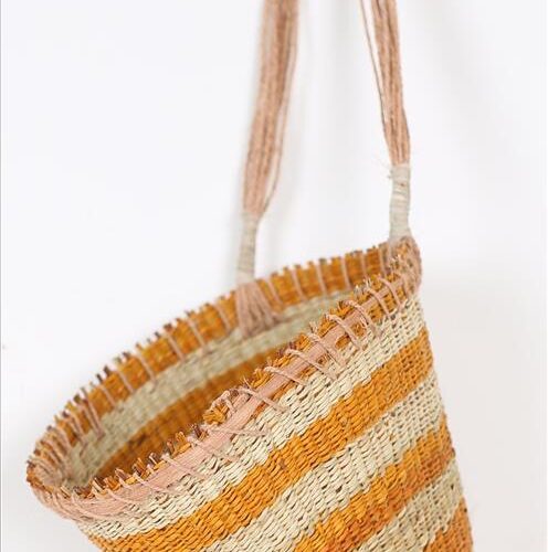 Woven basket with pandanus leaves and earth dyes