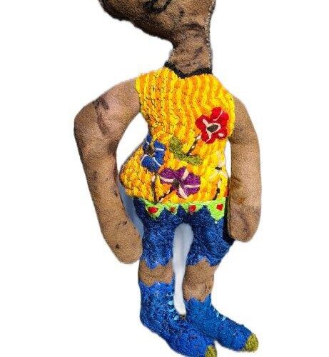 soft sculpture lady wearing colourful jumper