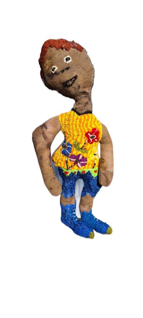 soft sculpture lady wearing colourful jumper